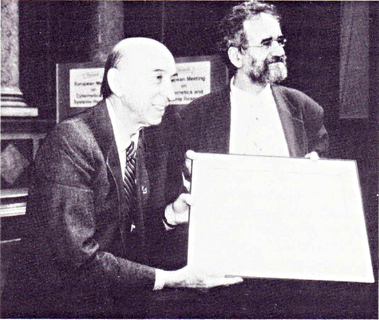 Prof. Lofti Zadeh (left) receiving an award from Prof. Robert Trappl at the EMCSR92 photo: Stephen Sokoloff, IFSR Newsletter 1993 Vol 13 No 1 (32)